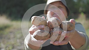 The farmer holding potatoes. Healthy food with vitamins. Fresh and organic food. Concept of vegetarians, organic and