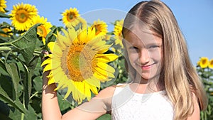 Farmer kid in sunflower agriculture field, teenager girl, child playing in agrarian harvest