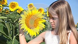 Farmer kid in sunflower agriculture field, teenager girl, child playing in agrarian harvest