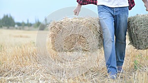 Farmer man with straw bales