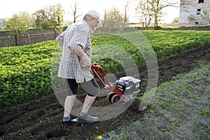 The farmer with a motor-cultivator