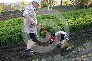 The farmer with a motor-cultivator