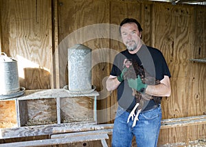 Farmer And One Of His Free Range Chickens