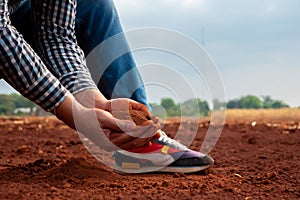 Farmer\'s hands hold the soil, nurturing the very foundation of his livelihood and sustenance photo