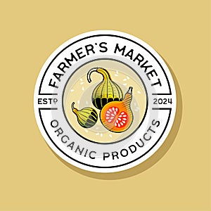Farmer\'s Market logo. Letters and bright pumpkins at engraving style in a round badge.