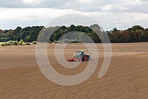 Farmer seeding crops at field