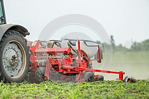 Farmer seeding, sowing crops at field