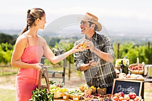 Farmer selling his organic produce to customer