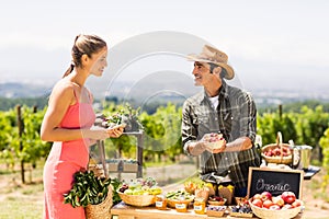 Farmer selling his organic produce to customer