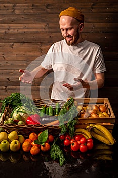 Farmer selling organic veg at market. Rustic style.Healthy food concept