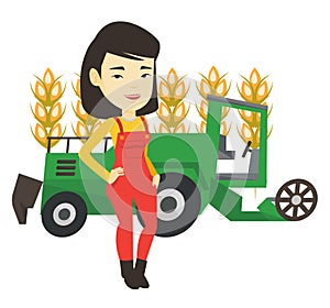 Farmer standing with combine on background.