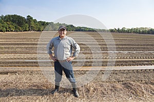 Farmer standing on farming land