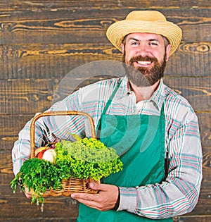 Farmer straw hat deliver fresh vegetables. Farm delivery service deliver fresh vegetables. Fresh organic vegetables in