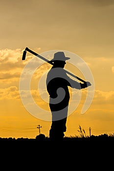 Farmer and sunset