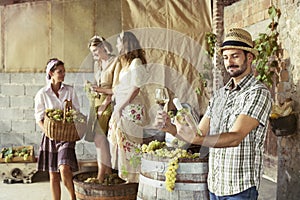 Farmer taste a glass of white wine. Harvesting time