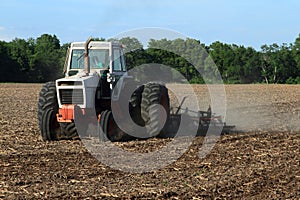 Farmer Tilling The Field