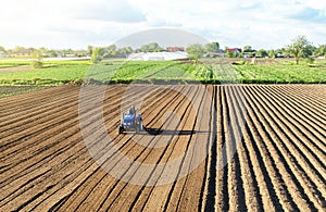 Farmer on a tractor cultivates land after harvesting. Mechanization, development of agricultural technologies. Grinding loosening