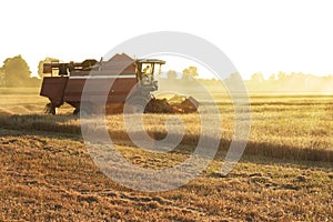 Farmer in tractor driving to the field