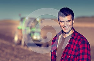 Farmer with tractor on field