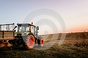 Farmer using modern tractor for harvesting