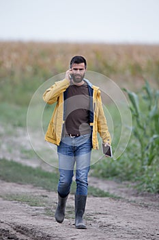 Farmer walking on farmland