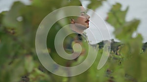 Farmer walking looking vineyard growing autumn day close up. Winegrowing concept