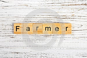 FARMER word made with wooden blocks concept