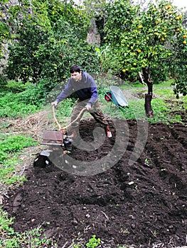 Farmer at work ploughing virgin soil.