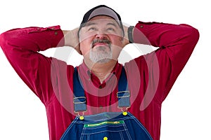 Farmer or worker in overalls looking up photo