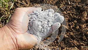 Farmers catch ashes for composting to nourish plants and vegetables they grow in organic farms