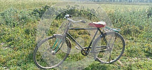 Farmers Park bicycle in field  riding by bicycle in madhubani bihar India photo