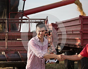 Farmers shaking hands during harvest