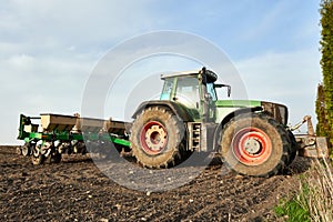 Farmers tractor working on field