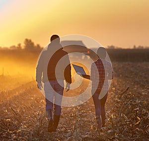 Farmers walking on field