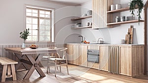 Farmhouse bleached wooden kitchen and dining room in white and beige tones. Cabinets and table with chair. Parquet floor. Wabi