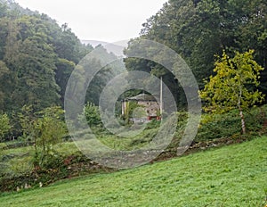 Farmhouse in a foggy valley - Triacastela