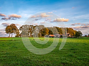 Farmhouse and meadows on countryside in Beuningen in Twente, Overijssel, Netherlands