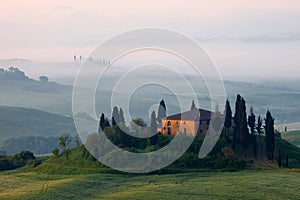 Farmhouse in Tuscany in the morning mist