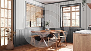 Farmhouse wooden dining room in white and gray tones. Cabinets and table with chair and bench. Wallpaper and parquet floor. Rustic
