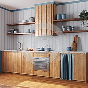 Farmhouse wooden kitchen with appliances in white and blue tones. Cabinets, wallpaper and parquet floor. Japandi interior design