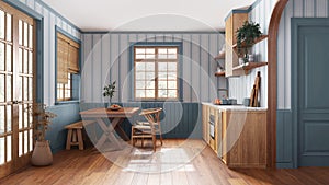 Farmhouse wooden kitchen with dining room in white and blue tones. Cabinets and table with chair. Wallpaper and parquet floor.