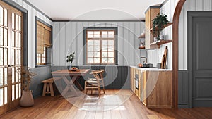 Farmhouse wooden kitchen with dining room in white and gray tones. Cabinets and table with chair. Wallpaper and parquet floor.