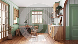 Farmhouse wooden kitchen with dining room in white and green tones. Cabinets and table with chair. Wallpaper and parquet floor.