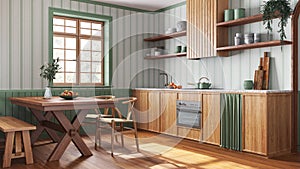 Farmhouse wooden kitchen and dining room in white and green tones. Cabinets and table with chair. Wallpaper and parquet floor.