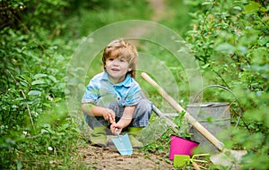 Farming and agriculture cultivation. small kid gardener planting a flower. human and nature. earth day. Eco life. summer