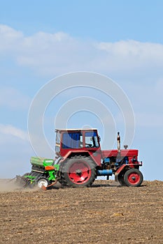 Farming tractor plowing