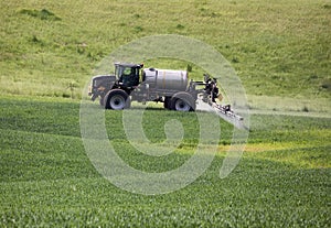 Farming tractor spraying