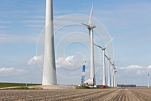 Farmland with construction work at the biggest windfarm of the Netherlands