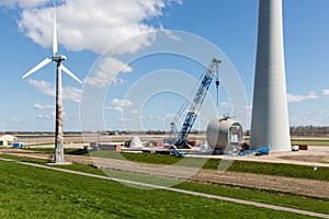 Farmland with construction work at the biggest windfarm of the Netherlands