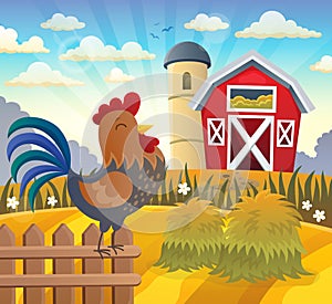 Farmland with rooster on fence